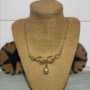 Vintage gold-tone necklace with faux pearls and drop pearl pendant.